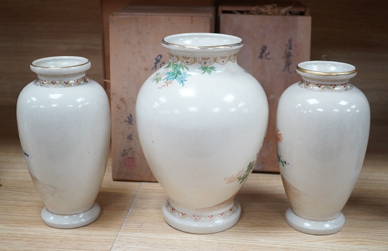 A pair of Satsuma earthenware baluster vases, and one other, larger, each with original wooden boxes, tallest 28cm. Condition - crazed